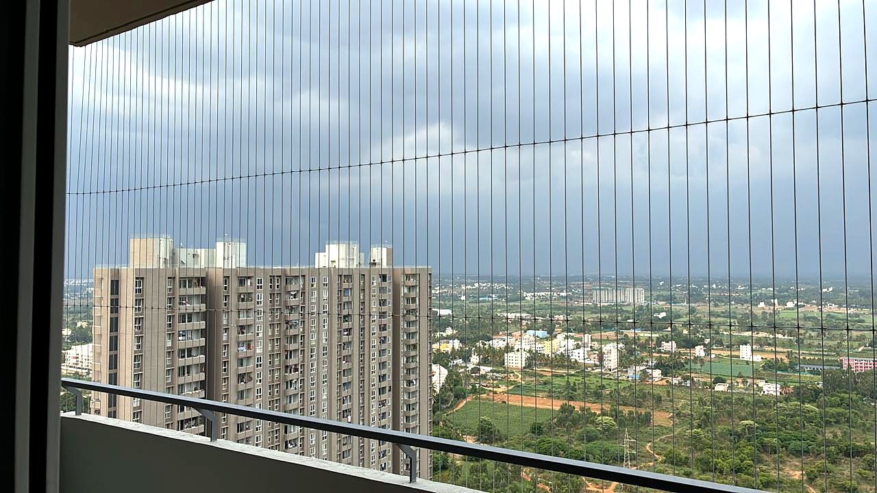 Invisible grill on a high-rise balcony in Bangalore